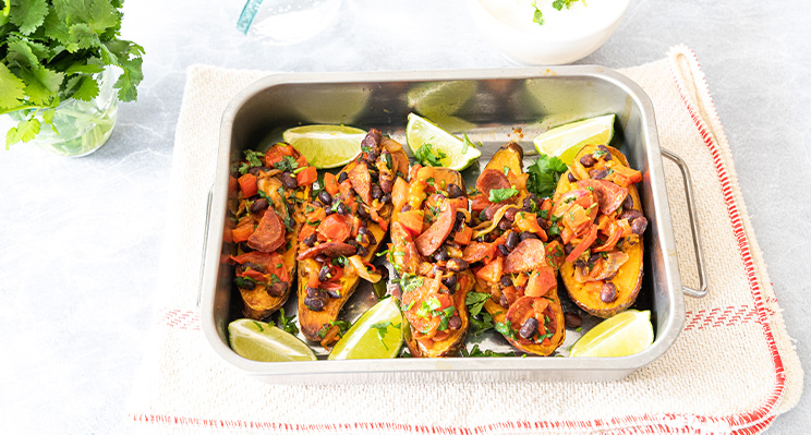 Baked Sweet Potatoes topped with a Chorizo, Black Bean, Lime, Coriander & Basil Dressing